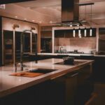 A large kitchen with a center island and stainless steel appliances