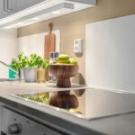 A kitchen with a stove and a sink